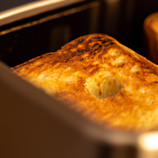 -up shot of a golden-brown, perfectly risen soufflé emerging from a compact toaster oven, with even heat distribution showcased by its uniformly baked surface, exuding a delectable aroma that entices the viewer